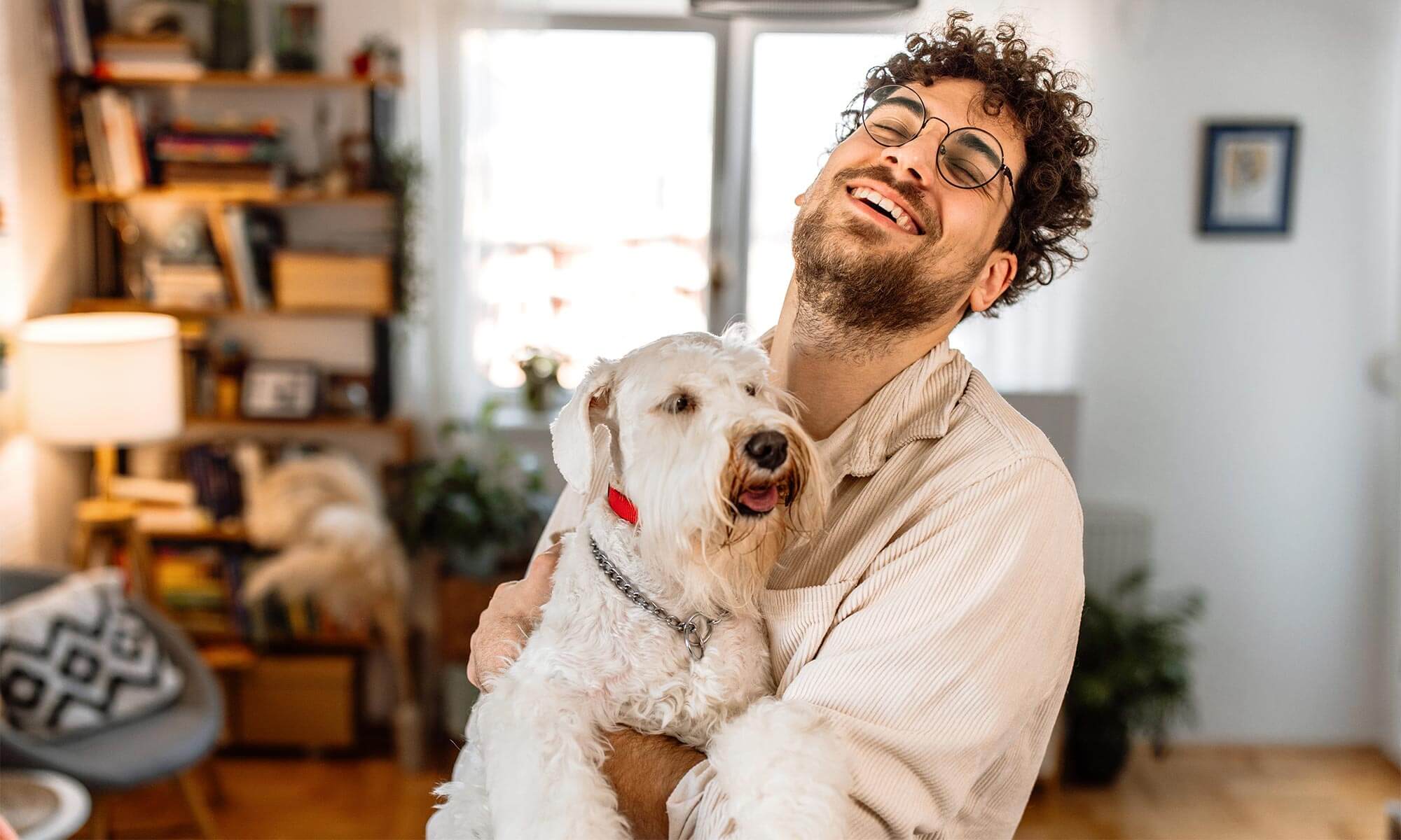 A man holding his dog